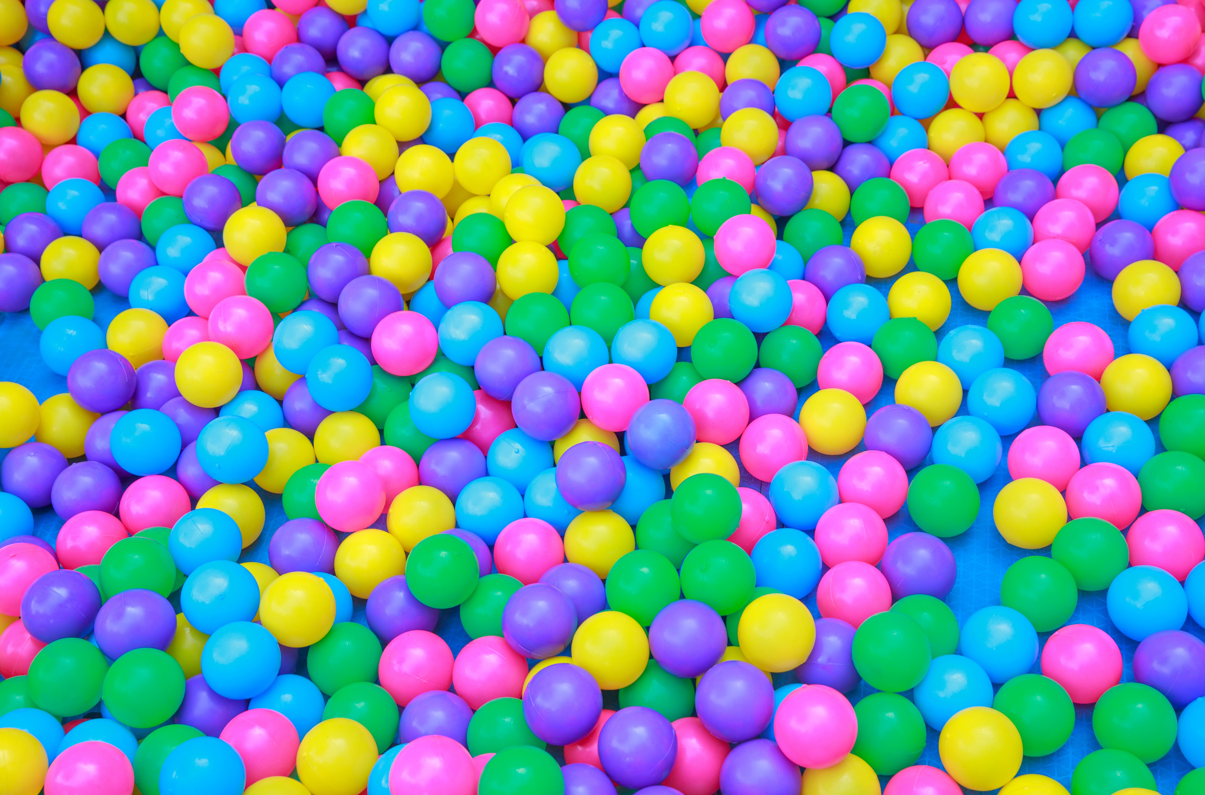 Heap of bright multicolored balls in playroom